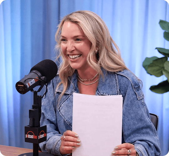 Podcast host speaking into a microphone